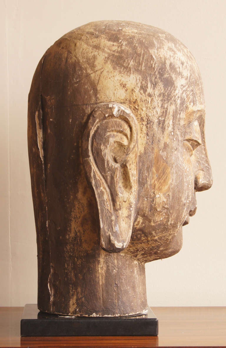 large wooden buddha head