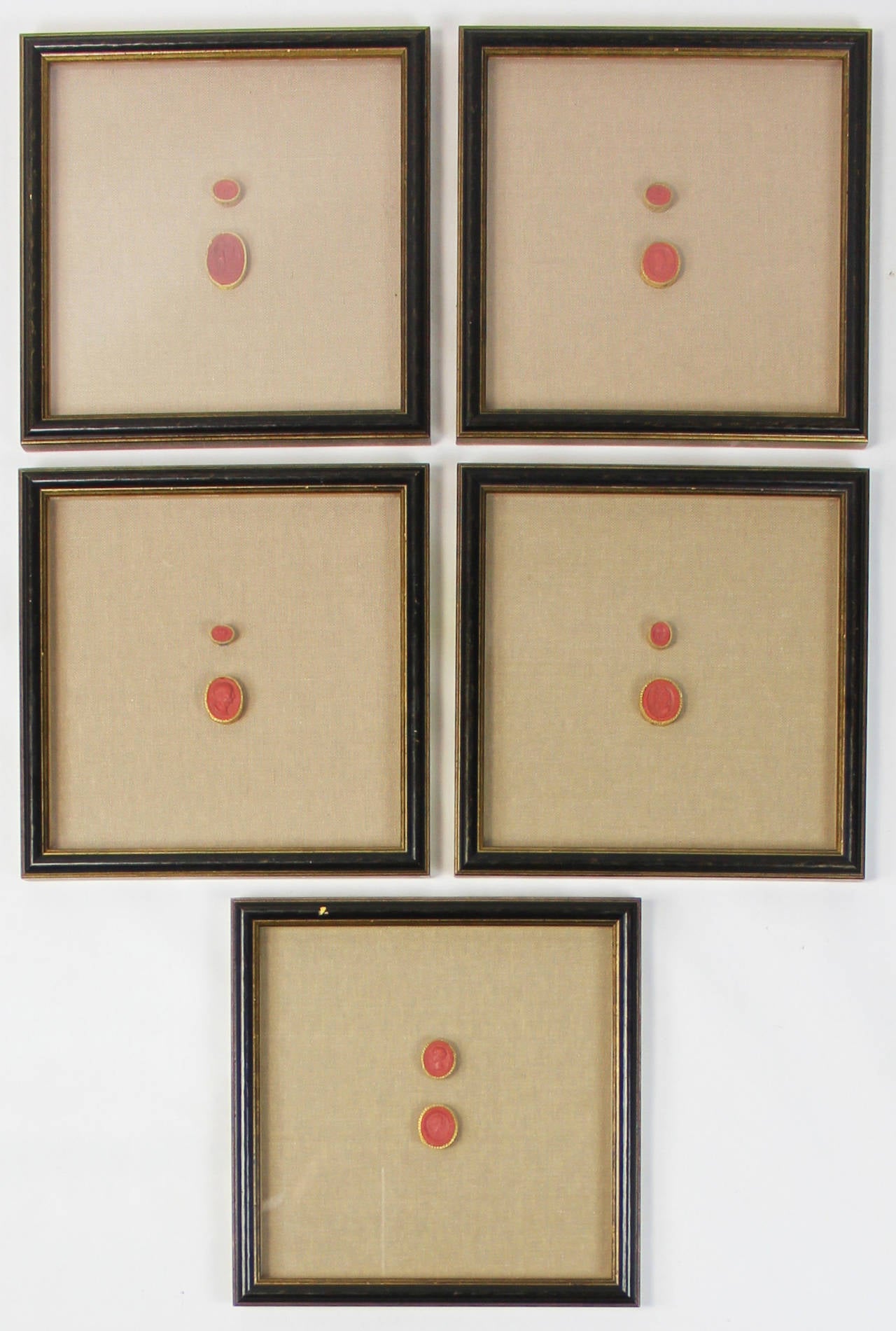 An outstanding collection of Grand Tour red Italian intaglios dating from the 1830s. Each intaglio is hand numbered and set in gilt braid, mounted on linen matting and displayed in ebonized shadow box frames.