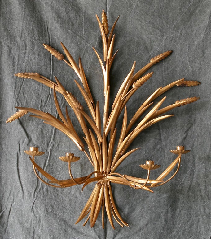 A large Italian gilt tole 4 candle sconce in the shape of a sheath of wheat.