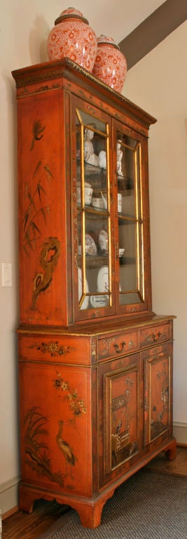 An early 19th century Japanned bureau bookcase with later Chinoiserie decoration. The interior is lined with silver/gold tea paper and fitted with glass shelves.