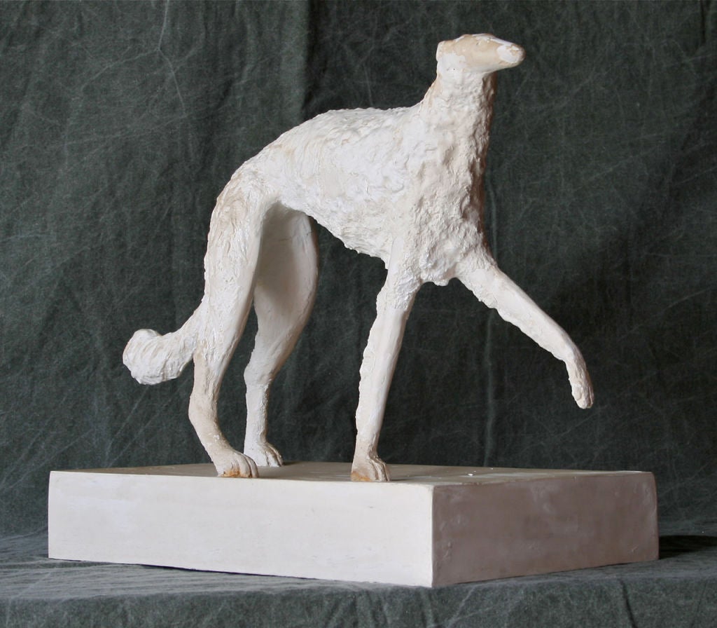 An elegant Art Deco period sculpture of a Borzoi made of plaster in the style of Giacometti, signed by the artist.