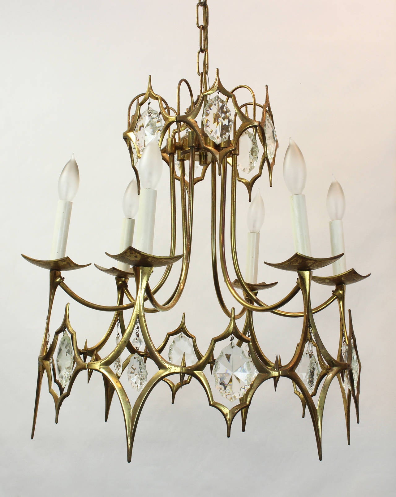 An elegant Regency inspired brass and crystal chandelier dating from the 1960s.