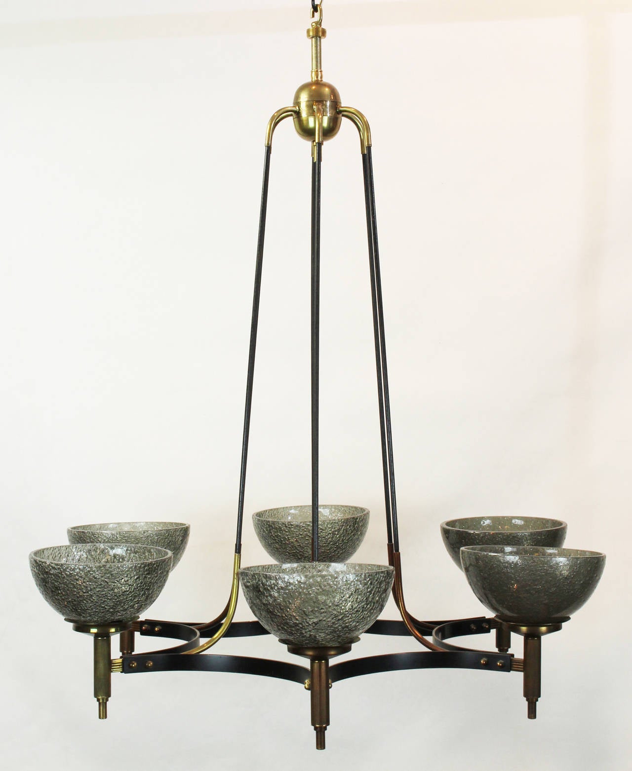 An Italian brass and handblown gray glass chandelier dating from the 1950s.