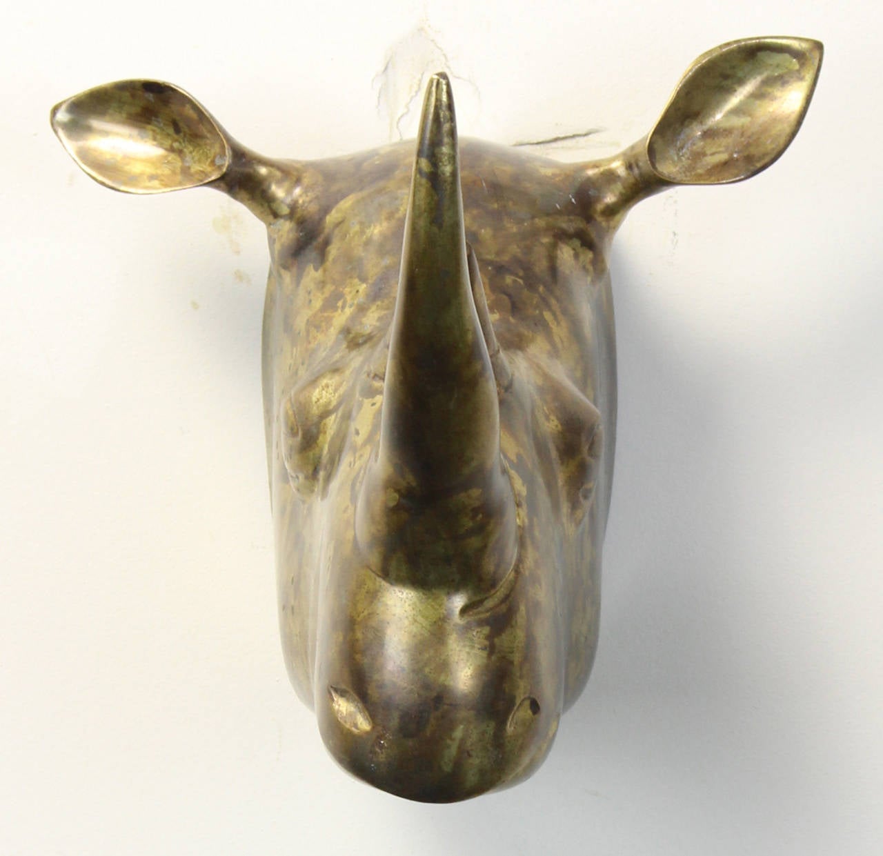 An unusual and very well done Italian cast brass wall-mounted rhino head trophy dating from the 1970s.