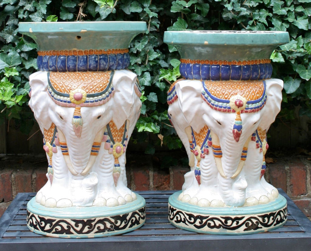 A charming pair of Indian elephant garden seats with minor differences between the two.