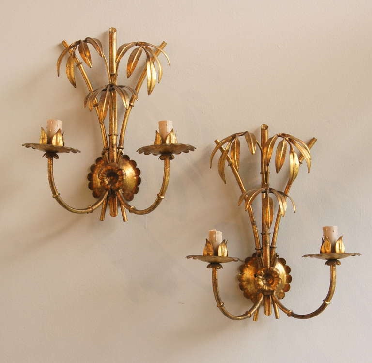 A delightful pair of Hollywood Regency Italian gilt-metal faux bamboo sconces.