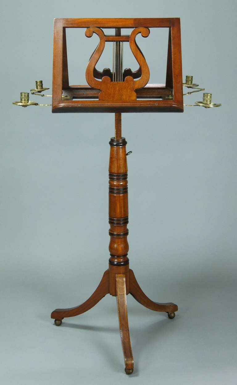 A fine English late Regency mahogany duet stand with ebony banding and inset brass accents, four candleholders.