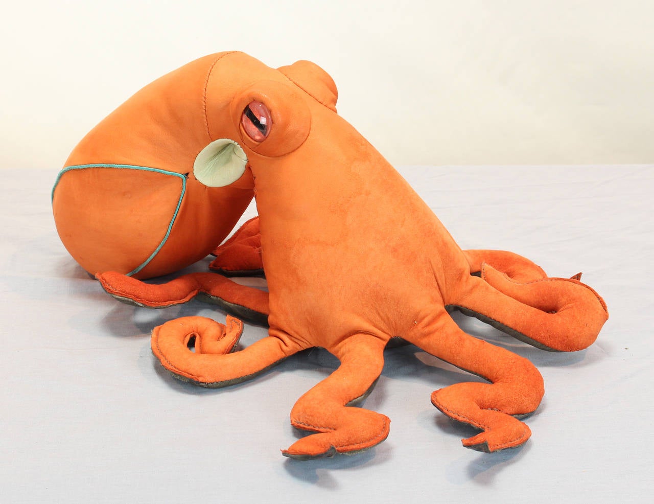 An original custom designed suede octopus with glass eyes.