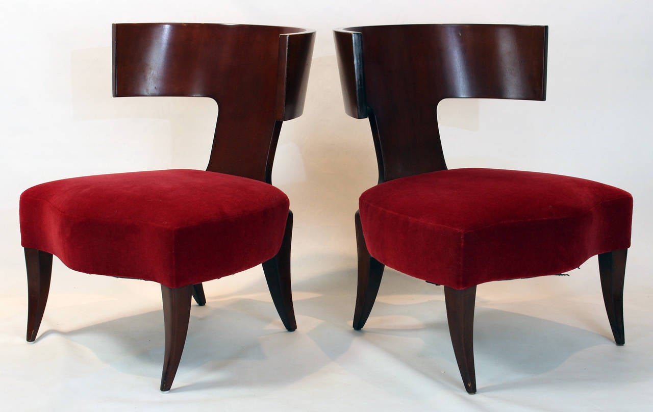 A pair of mahogany Klismos style slipper chairs covered in red wool mohair by Angelo Donghia.