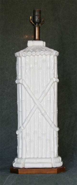 A charming large scale white ceramic lamp in the form of bamboo reeds.
