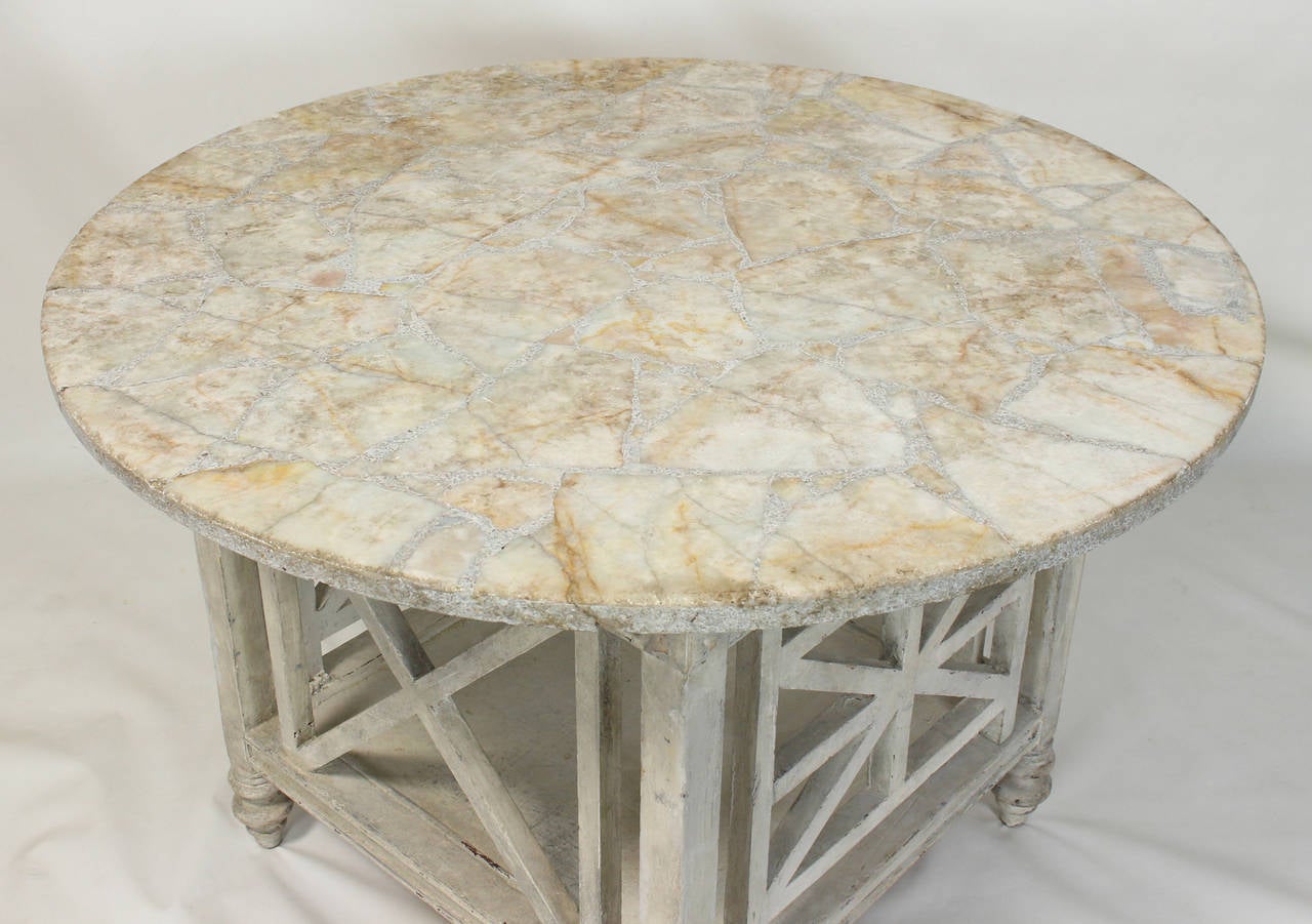 A Chinese Chippendale fretwork wood base dating from the 1940s with wonderful old dove-gray painted surface with a travertine and marble fragment top. Could also be used with a glass top as shown in photographs.