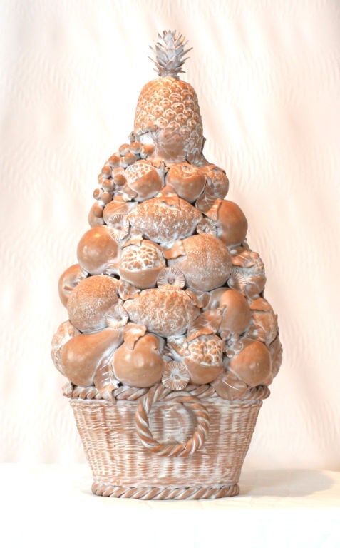 An exceptionally large and very charming terra cotta centerpiece/sculpture <br />
made to resemble freshly picked fruit stacked in a woven basket