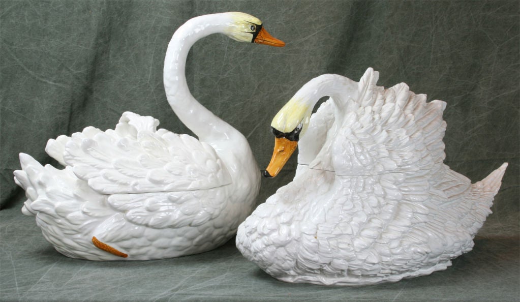 A large pair of Italian hand-painted glazed ceramic soup tureens in the form of swans