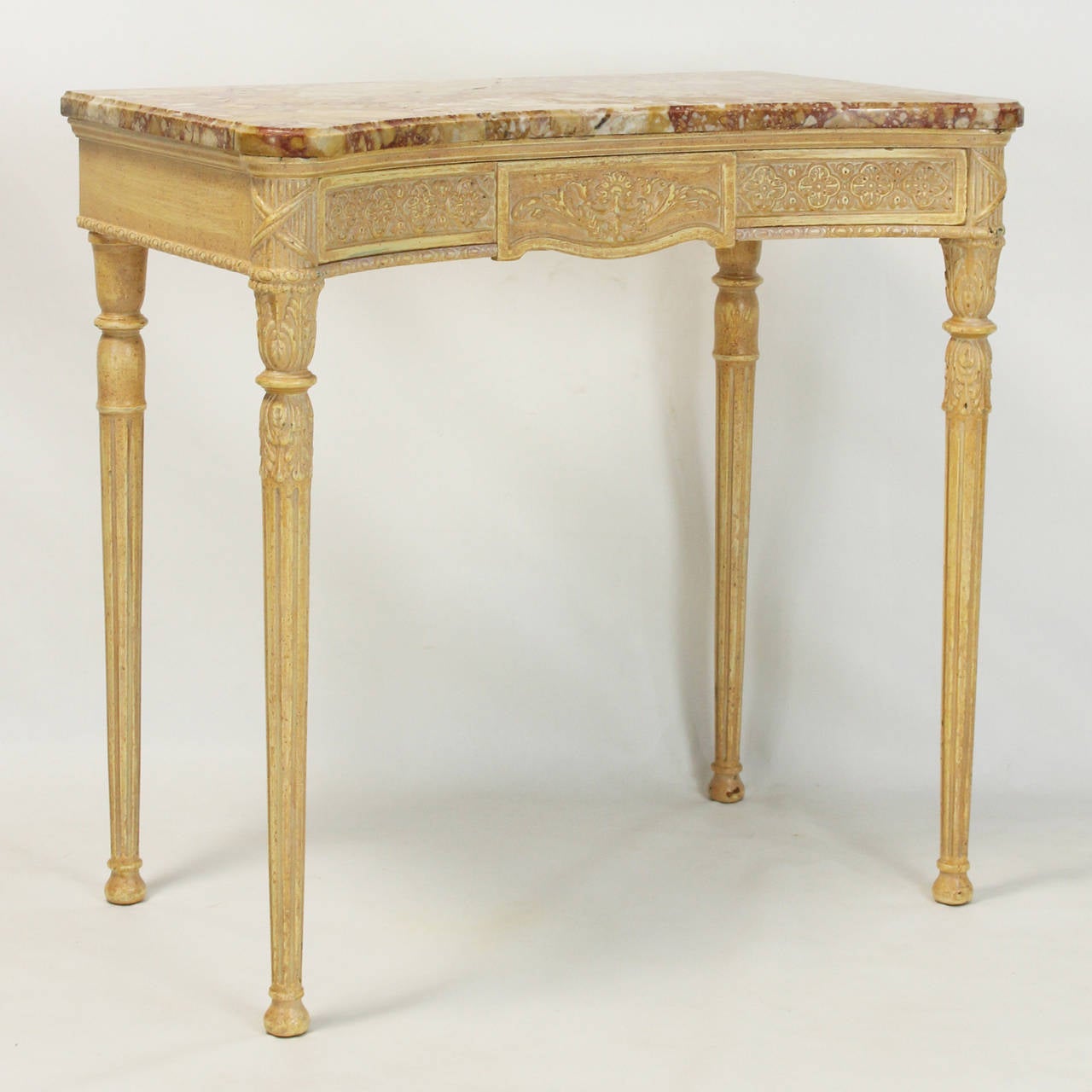 A late 20th century Louis XVI style painted freestanding console table with rose marble top and apron concealed center drawer.