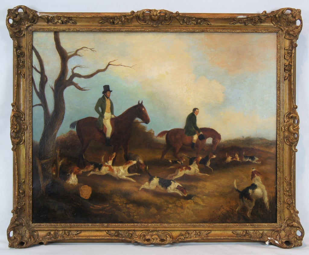 A large mid-19th century English oil on canvas painting of a fox hunting scene. The hunters are in green velvet coats with buff colored waistcoats. The frame is original to the painting.