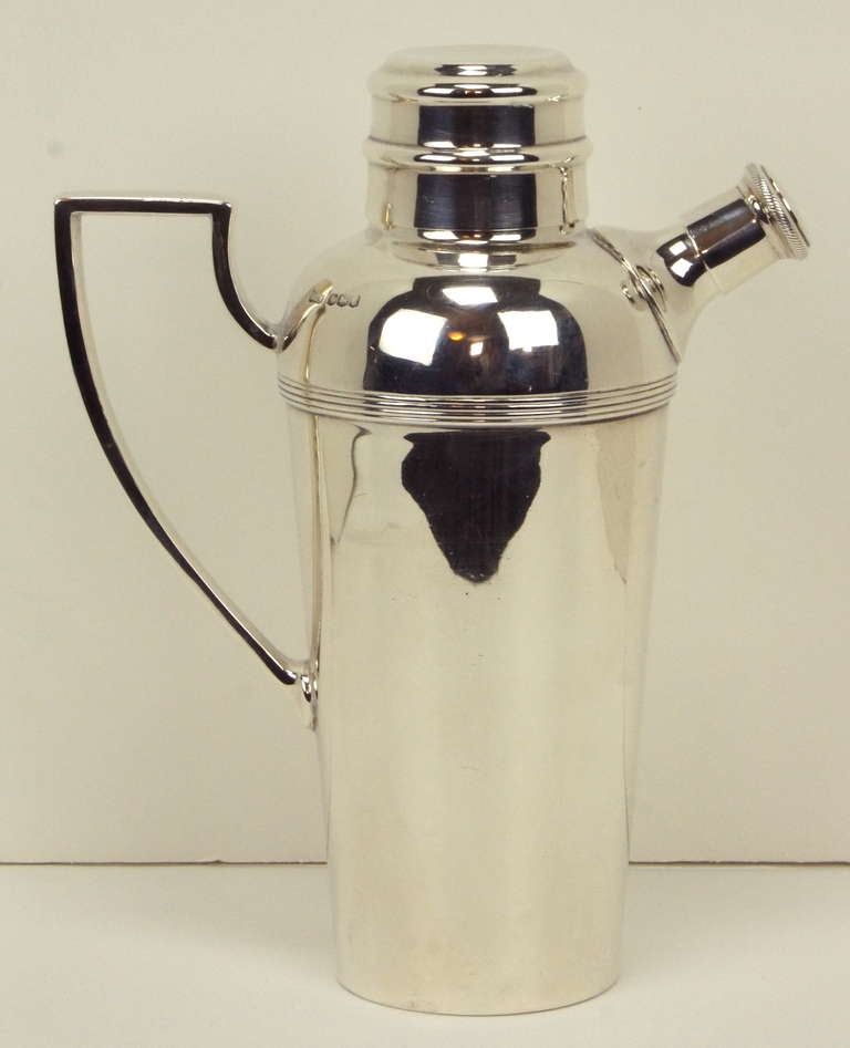 An very elegant sterling silver Art Deco cocktail shaker made by noted London silver smith Mappin & Webb (with hallmarks and makers mark).
