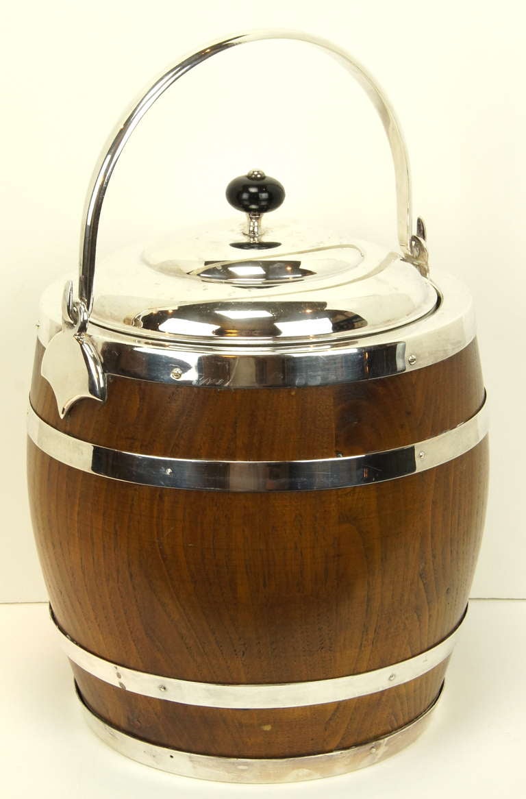 An extremely large and charming covered ice bucket in the form of a wooden barrel by noted Spanish silver smith Valenti & Co.