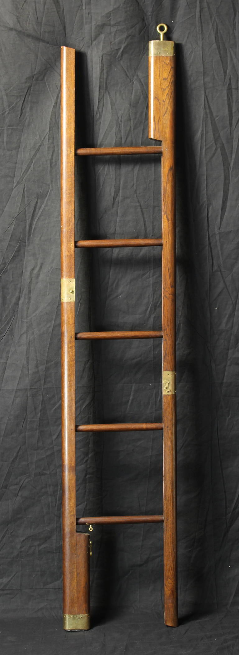 An English Edwardian style mahogany and brass folding pole ladder