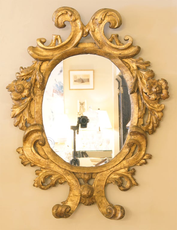 An elegant Italian Baroque mirror, beautifully carved and gilt frame, later mirror plate.