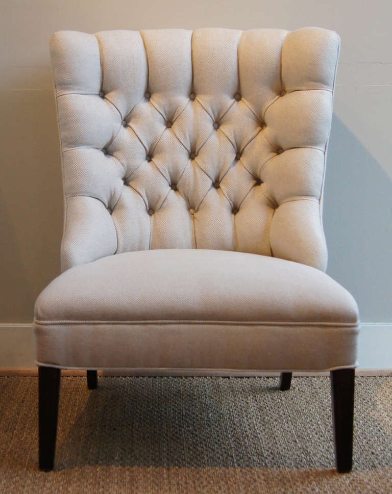 A pair of Regency inspired slipper chairs dating from the 1950's newly upholstered in pale gray Italian linen fabric.