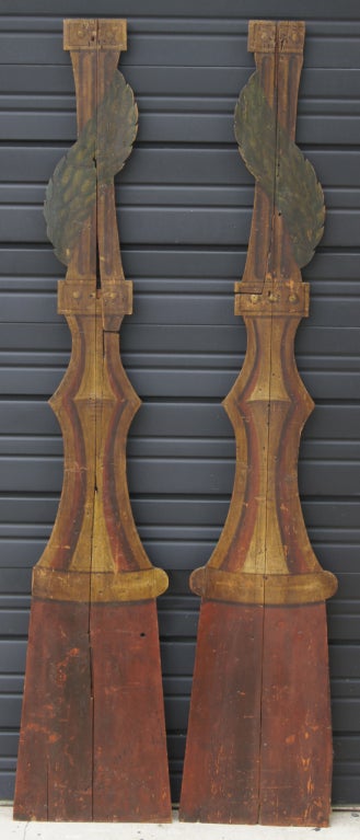 A pair of polychrome painted wooden panels of garden columns intertwined with garlands or vines. Props originally from a theatre in Stockholm, Sweden.