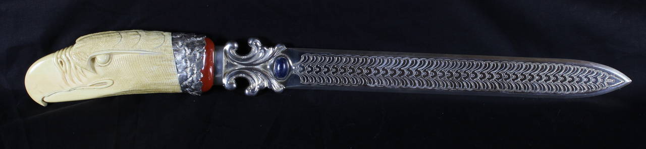 This exceptional Continental silver page turner is set with semi-precious stones and a large and beautifully carved eagle head hilt. Marked 