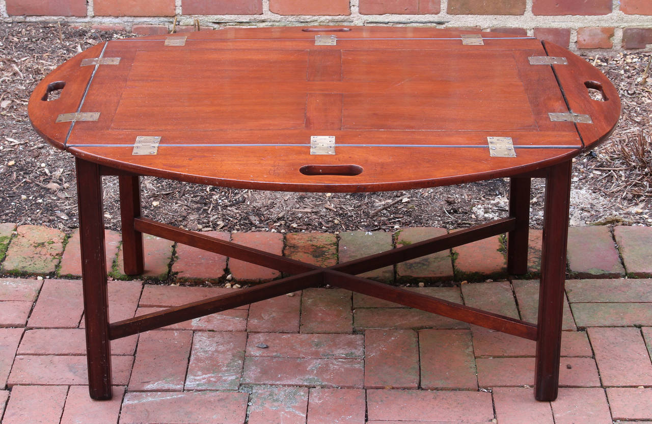 A Classic mid -9th century English mahogany butler's tray table of beautiful color and condition, on square legs connected by an X-stretcher.