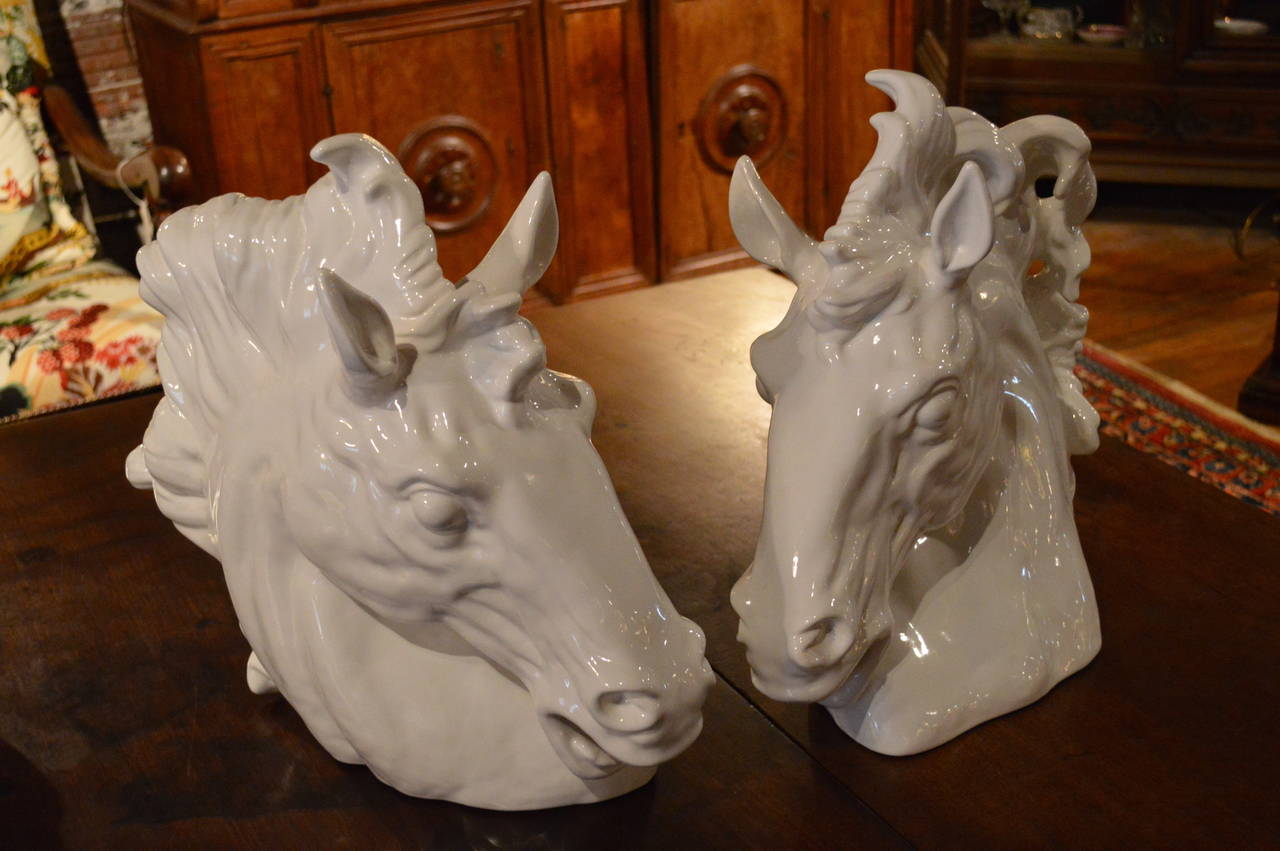 Large pair of white Italian Mid-Century Majolica horse busts, finely modeled.