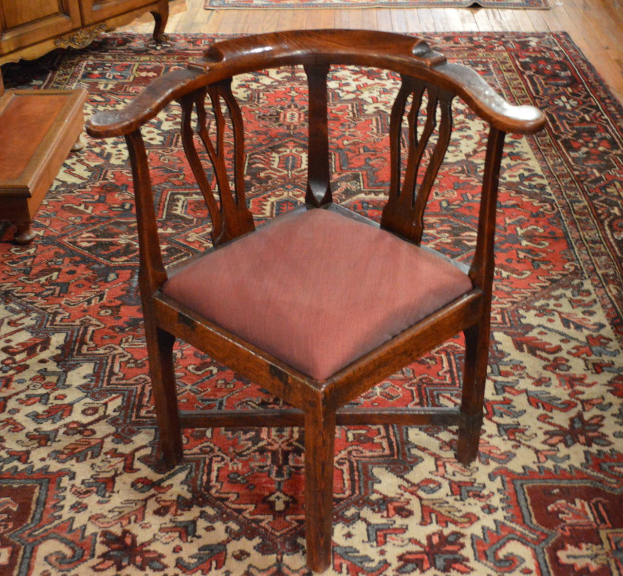 18th century Scottish elm corner chair with pierced vasiform splats, turned arms, X-cross stretcher, straight legs, slip in seat, nice old surface.