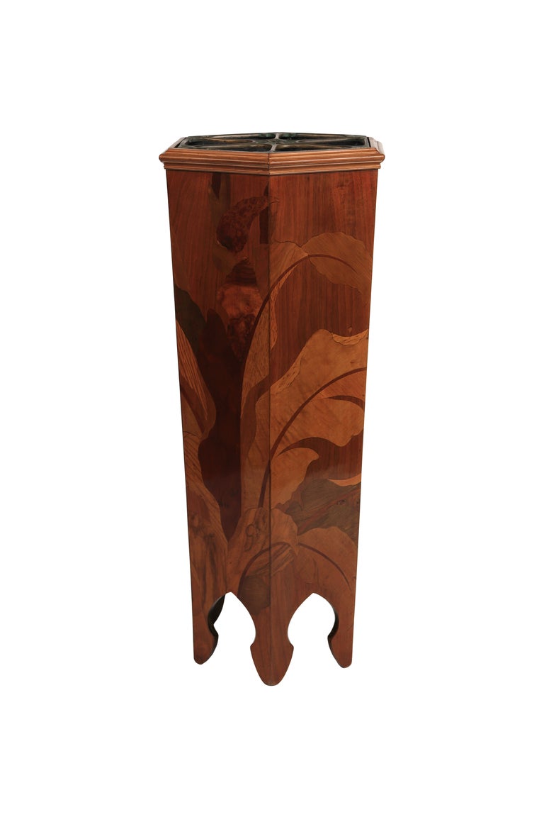 A rare and unusual French Art Nouveau umbrella stand by, Emile Gallé decorated with marquetry Inlaid Walnut, Tulipwood and Fruitwood depicting a budding tulip and retains its original decorated liner. 

Reference:
The identical stand is