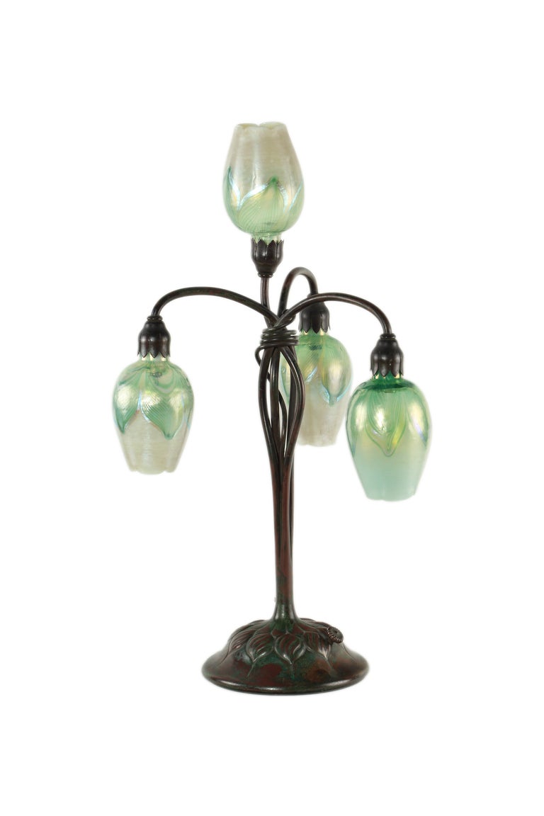 An American Art Nouveau patinated bronze and favrile glass 