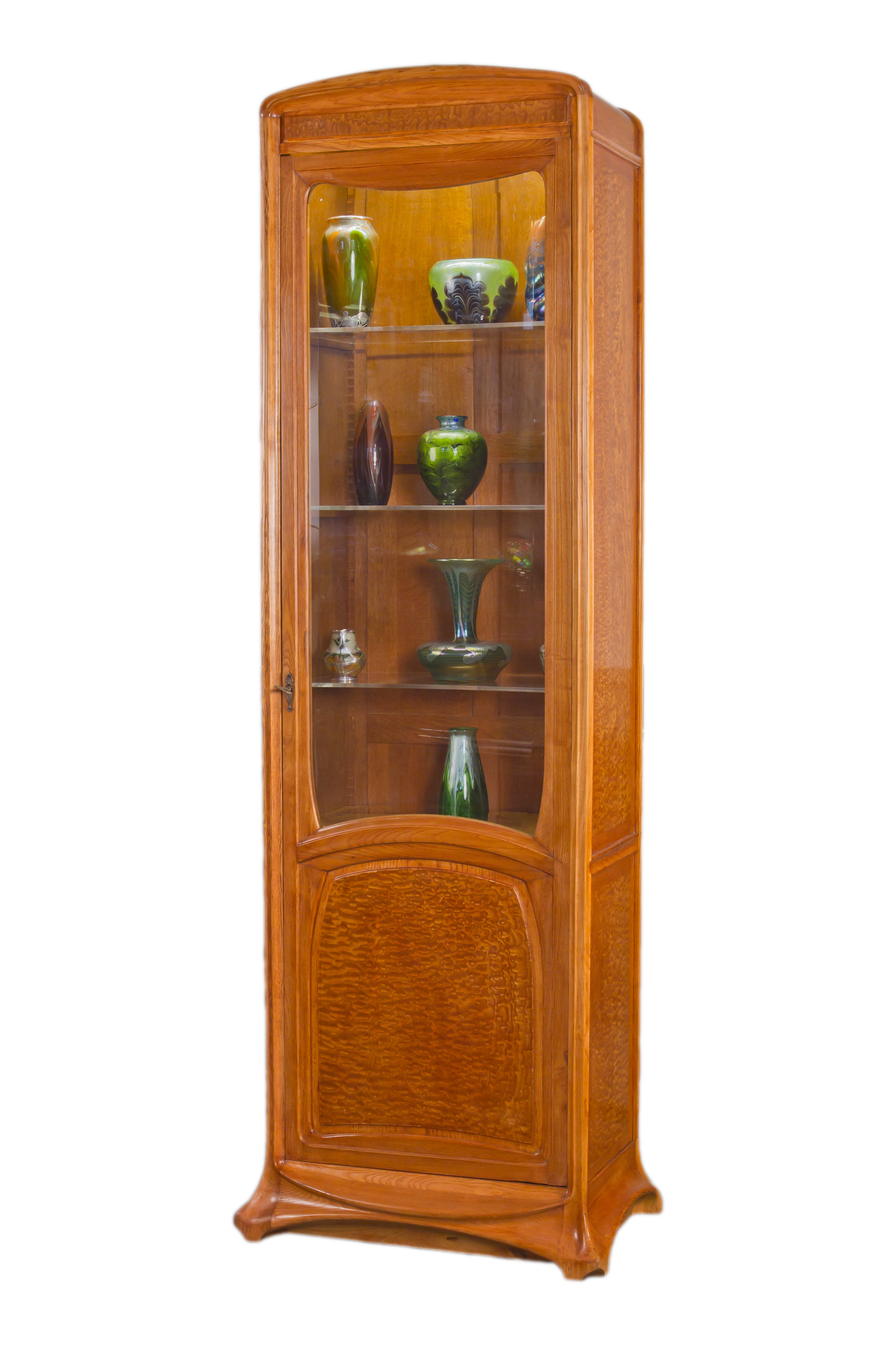 A Pair of Art Nouveau Carved Wood Display Cabinets by, Louis Majorelle
