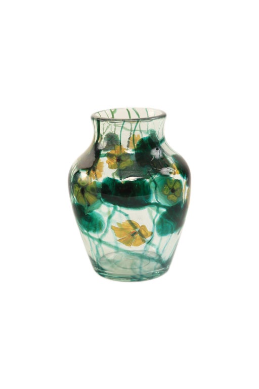 Tiffany Favrile “Anemone” paperweight vase by, Tiffany Studios decorated with   yellow anemones with Milifiore centers amongst leafage against a clear background. The vase is signed, “3527 P L.C.Tiffany Favrile” and retains remnants of an original