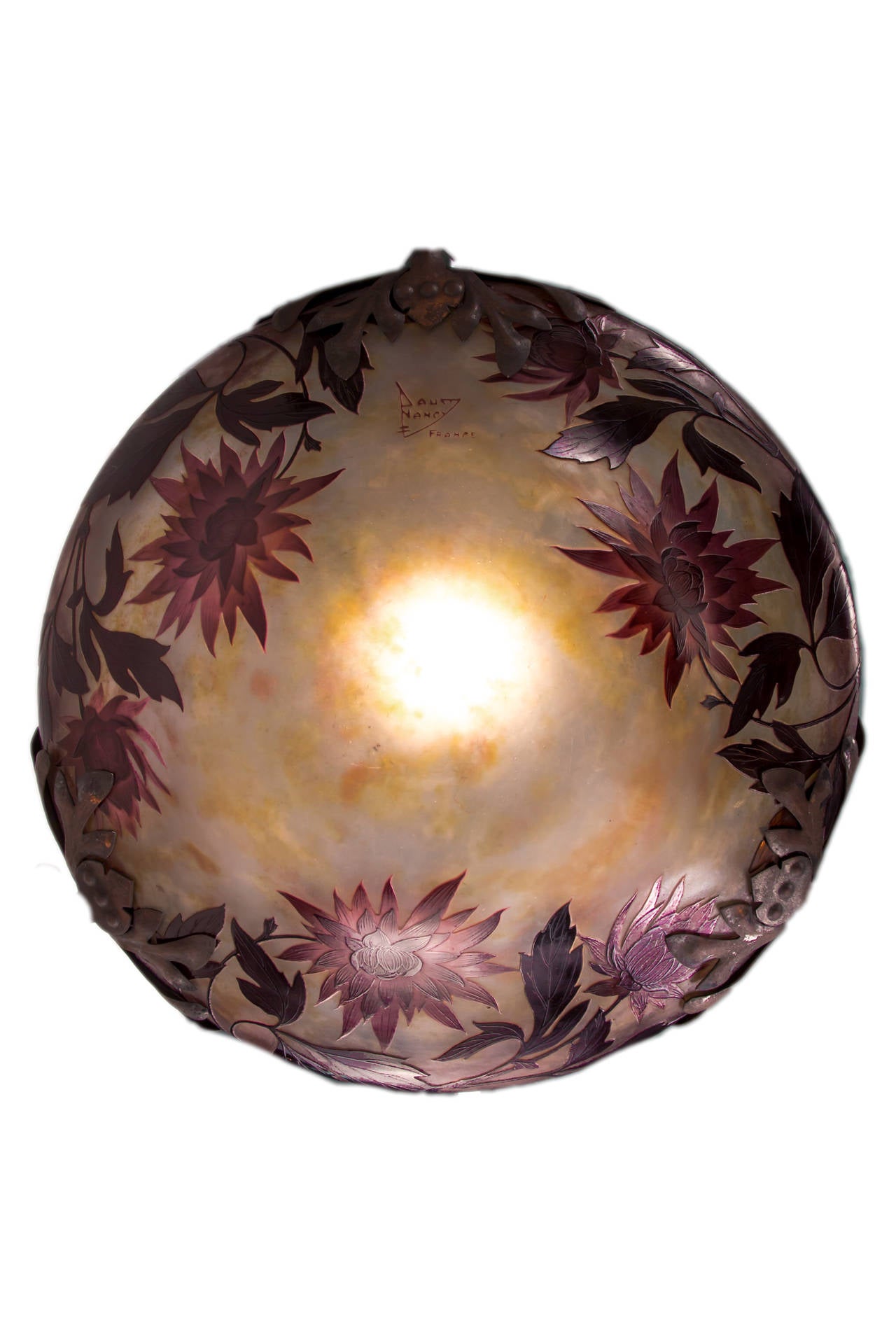 A fine French Art Nouveau cameo carved glass and bronze chandelier by, Daum Nancy decorated with a central craved cameo plafonnier with purple-plum color floral and vine decoration against a mottled opaque white - yellow background further enhanced