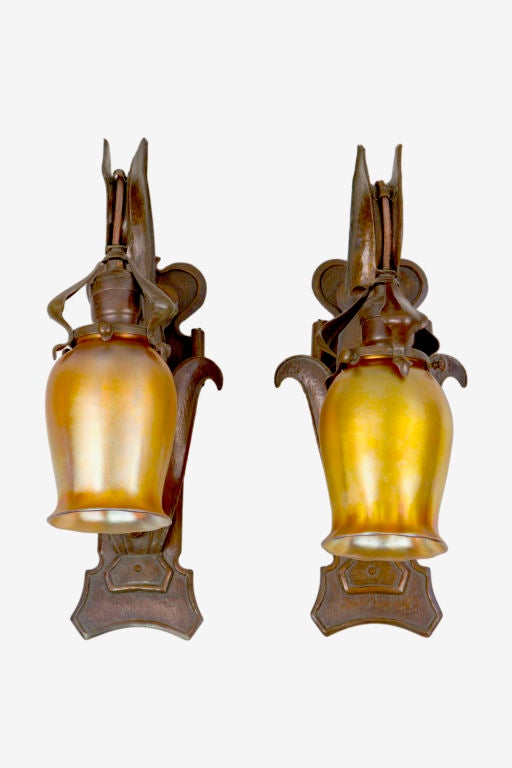 Pair of  Art Nouveau copper patinated sconces decorated with matching iridized gold 