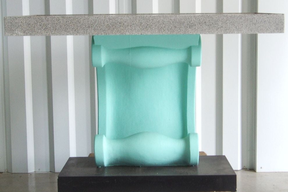 Wave Console from a historic Miami Art Deco hotel.  Console has black glass top with a faux granite border and sea foam green plaster wave base.

4313