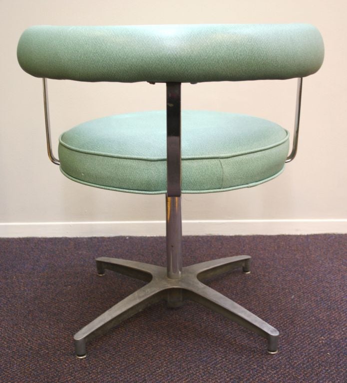 20th Century Pair of Mid Century Chrome and Teal Vinyl Swivel Chairs
