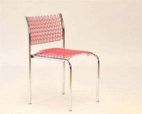A mid century inspired tubular steel frame chair by David Roland for Thonet. The seat and back are composed of a rubber 