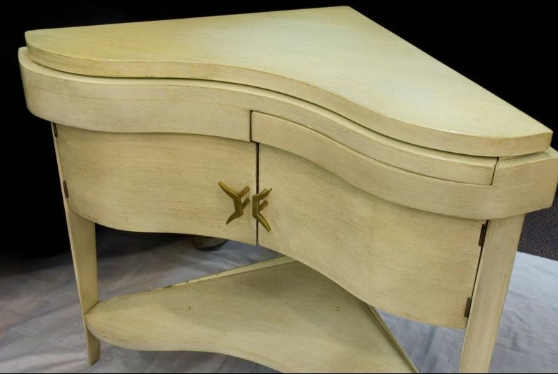 Cream lacquered Italian corner bedside tables with unusual puzzle-like pull out shelf above two cabinet doors. Solid brass handles.<br />
<br />
Reduced From: $3,750