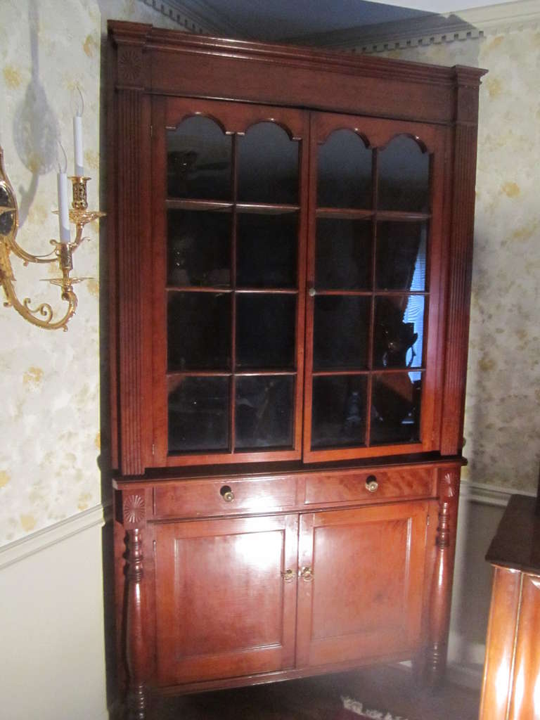 An early 19th century Southern cherry corner cupboard.  Beautiful mellow patina. Hand carved rosettes in each top  corner.  One piece.  Requires a 36” corner.

Good condition with age appropriate wear.

Reduced from: $9,750