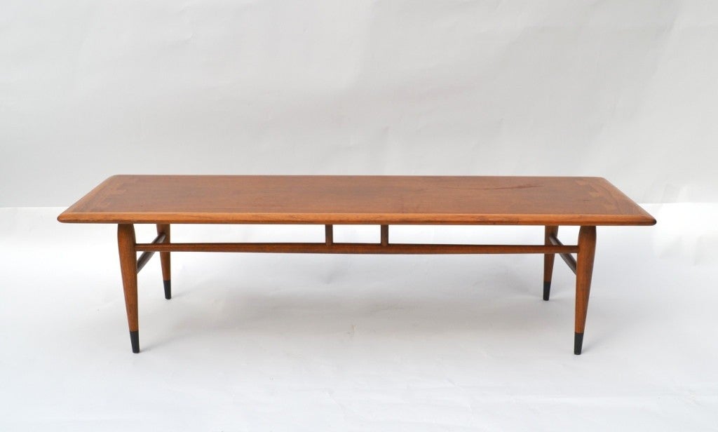 A vintage coffee table by Lane in Walnut with tapering legs and 