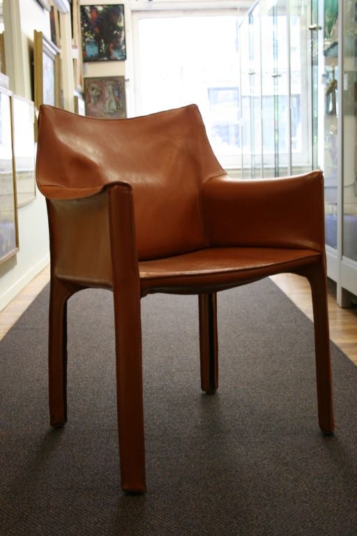 Pair of vintage CAB chairs by Mario Bellini for Cassina in cognac leather over a steel frame.