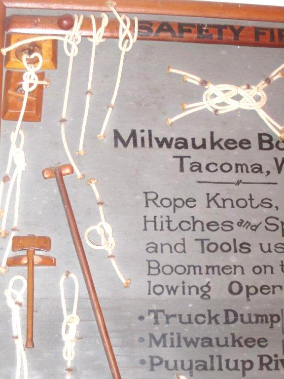 A vintage Folk Art sign depicting knots and other decorative elements. The piece was most likely handmade by an employee of the Milwaukee Boom Co. which was founded in 1887 and built world class tugboats. The folk art board features numerous