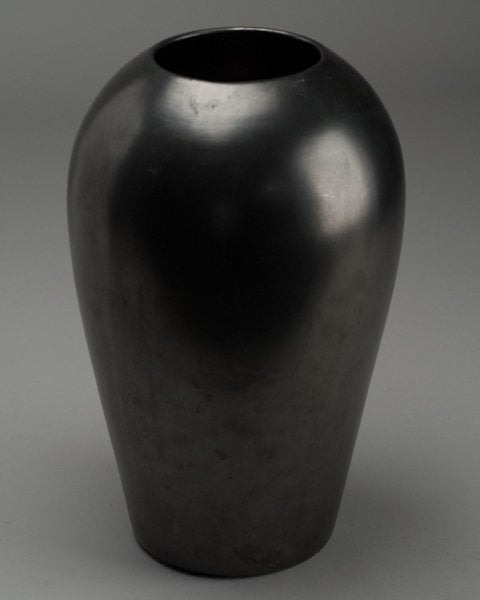 A vintage Vase by Haeger with charcoal grey metallic glaze.  Label on base 