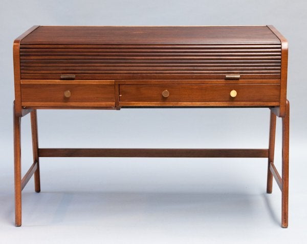 A vintage walnut roll-top writing desk by Sligh-Lowry; marked inside drawer. Age appropriate wear.