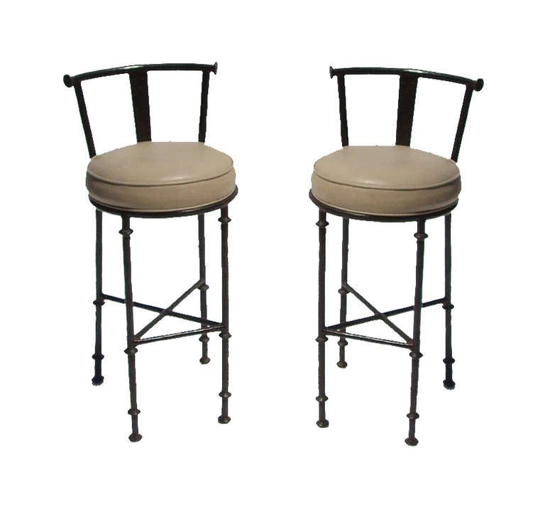 A pair of vintage metal barstools with bronze toned finish by Pierce Martin