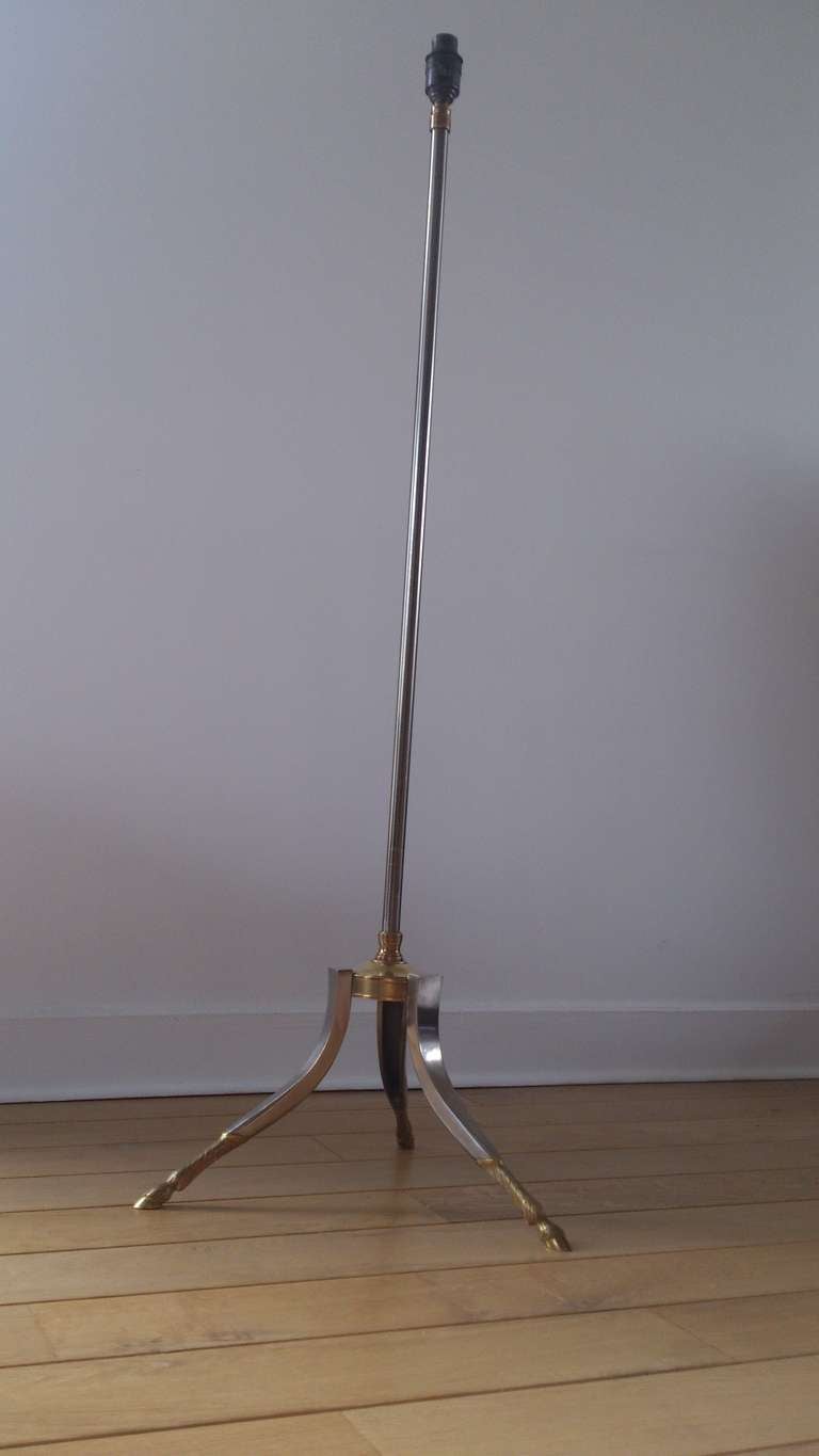 A vintage floor lamp by Maison Jansen in steel with brass accents and three 