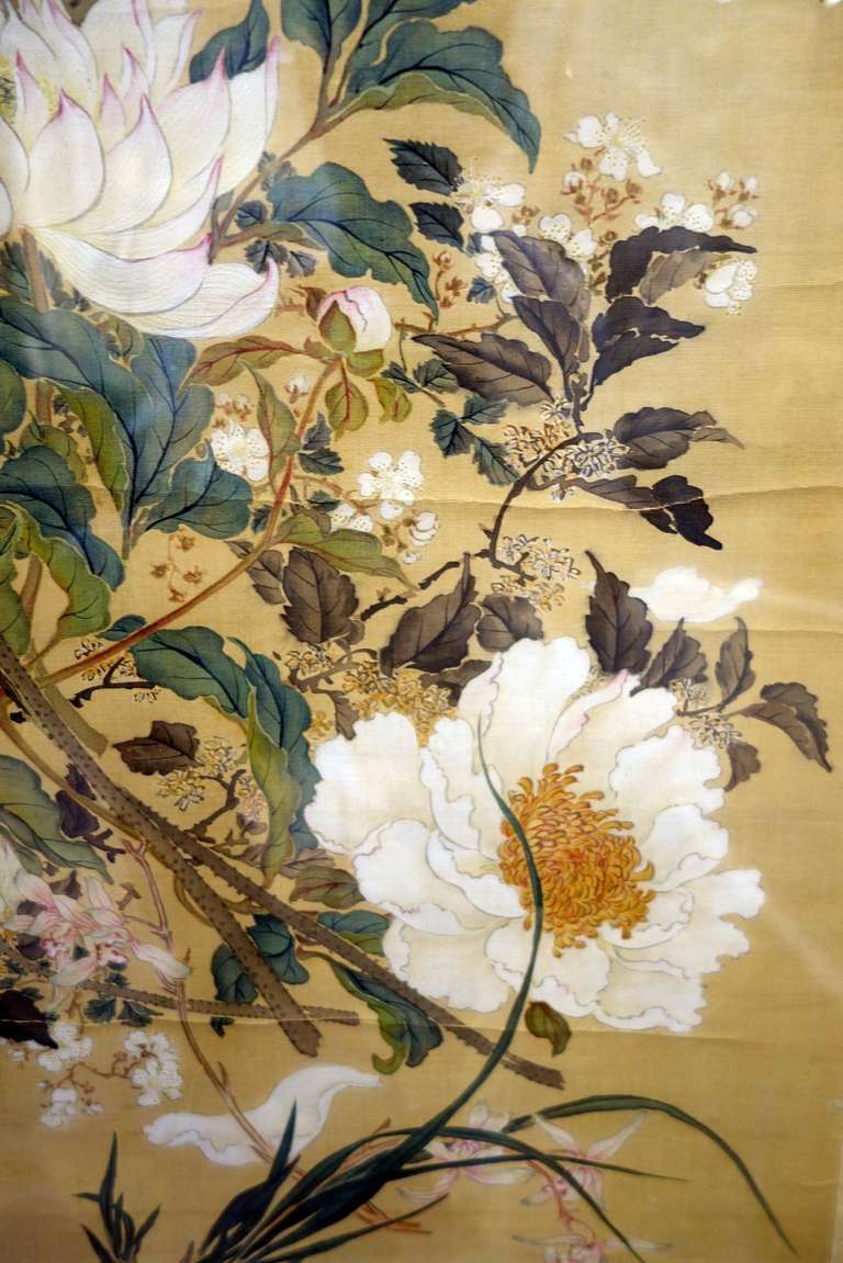 An 18th century pair of two beautiful ink and color on silk paintings from China. There are twelve kinds of flowers painted. The paintings are titled,