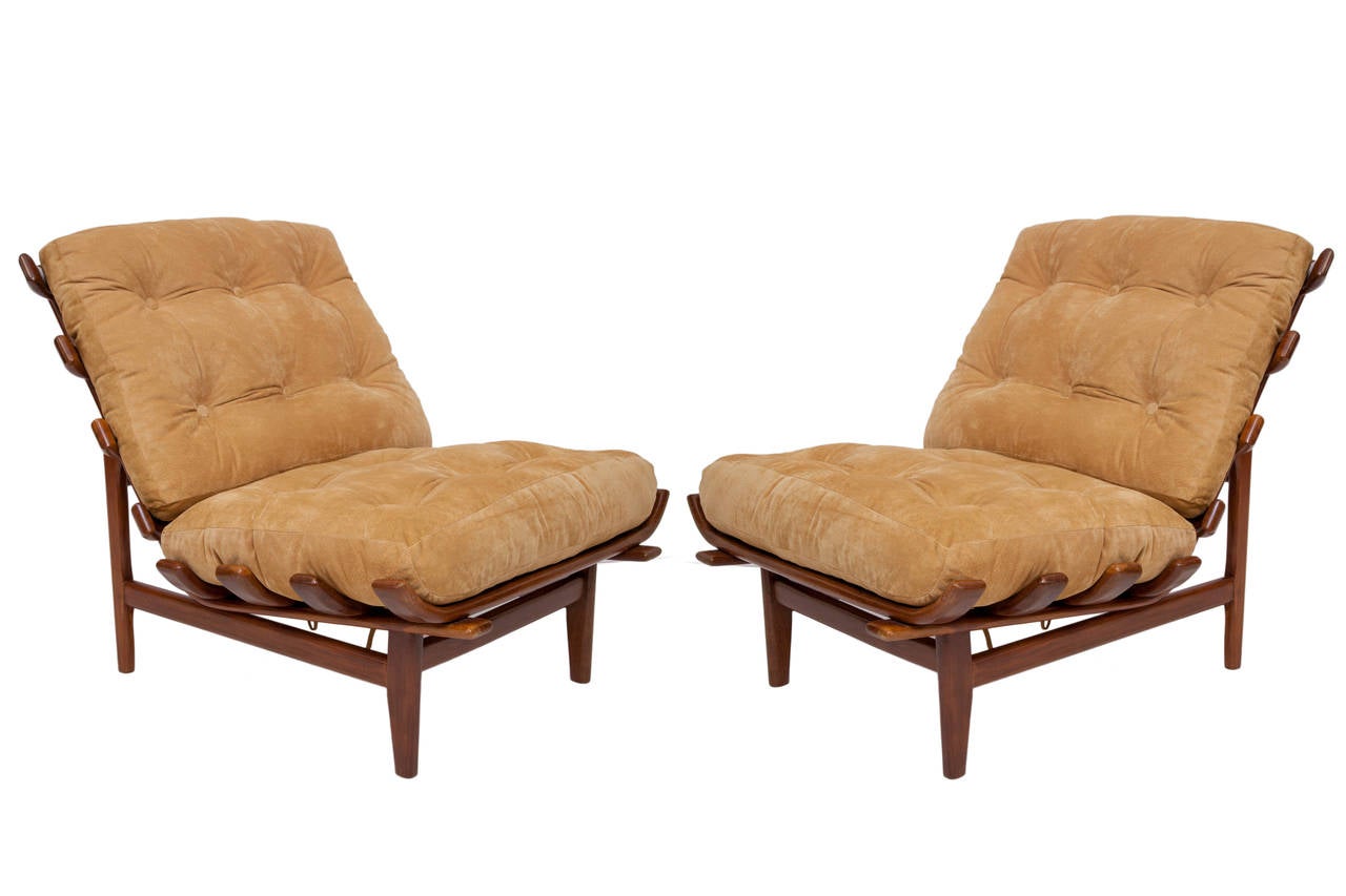 A vintage pair of rib chairs, produced circa 1950s and attributed to designer Martin Eisler, in Brazilian Imbuia wood frames, with seat and back upholstered in tufted mustard-yellow suede. Good vintage condition, consistent with age and use;