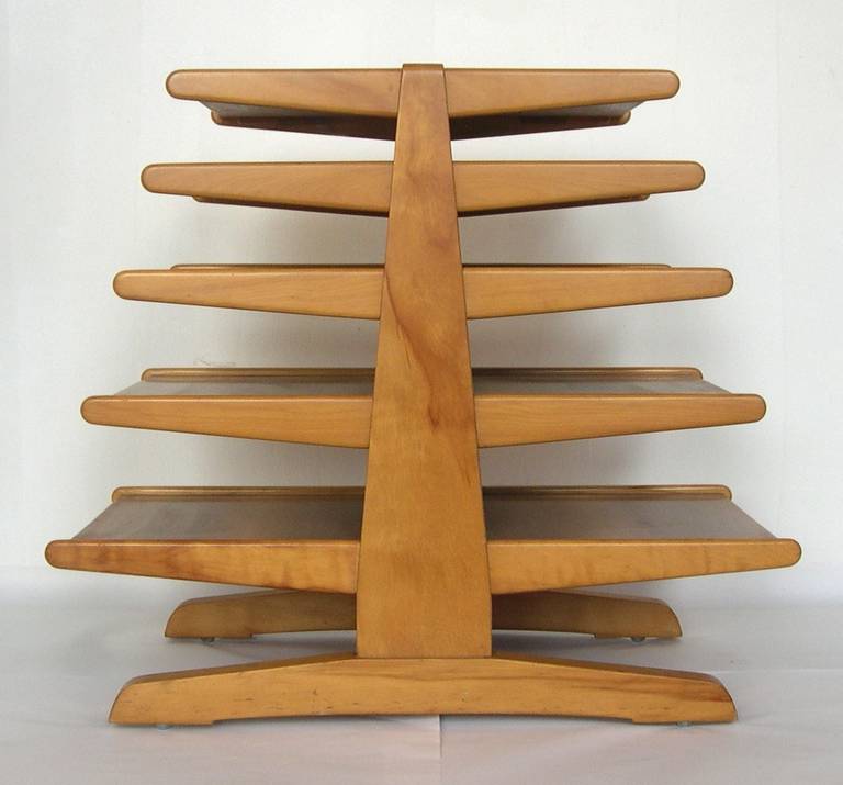 A vintage sculptural Dunbar magazine tree with five cantilevered shelves by Edward Wormley. Good vintage condition with age appropriate wear.